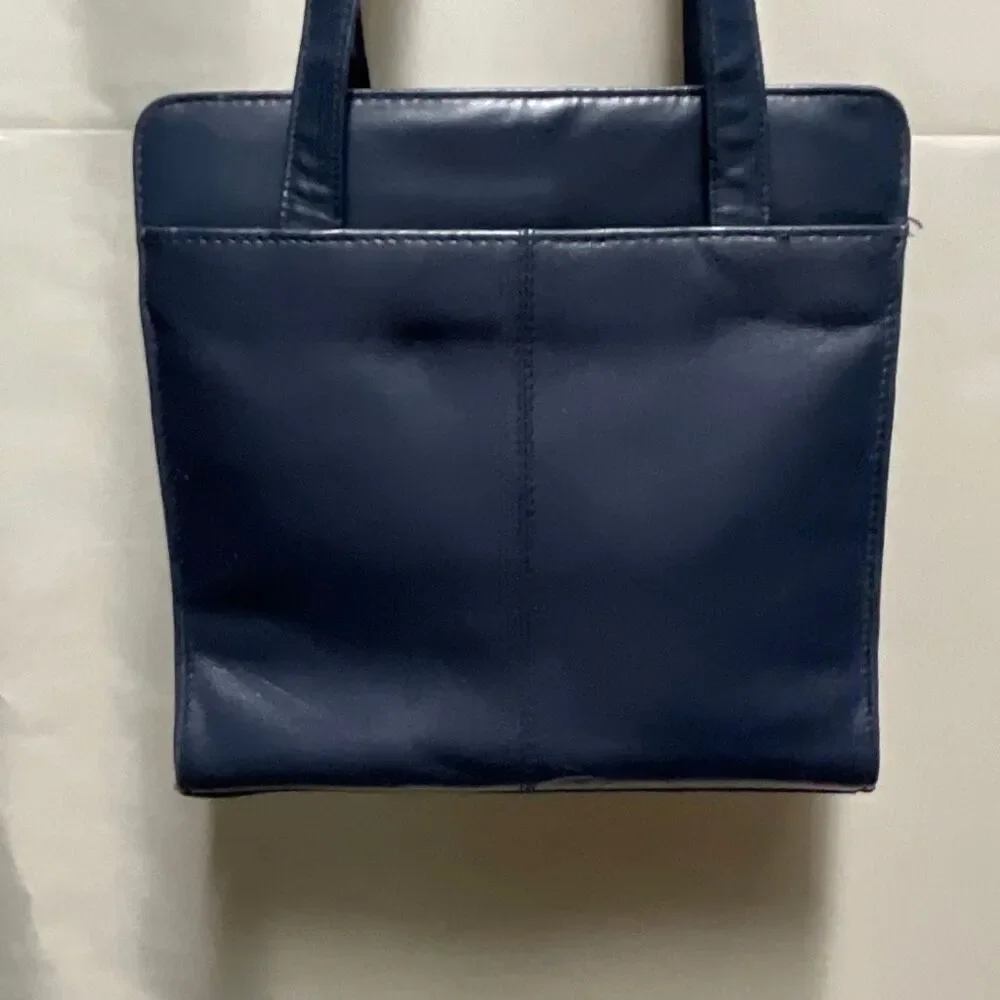 Vintage Colette blue leather shoulder bag.
